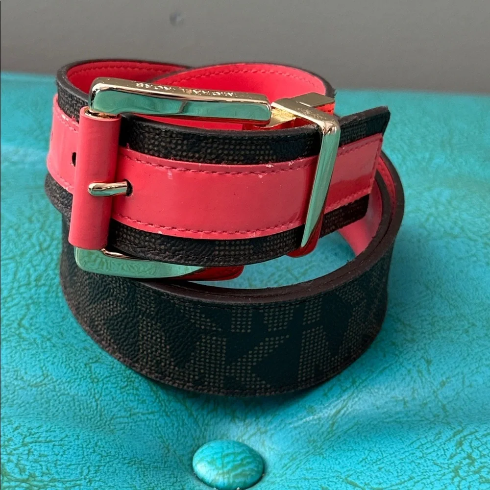 Reversible Michael Kors MK logo belt with bright shiny coral side - see flaw